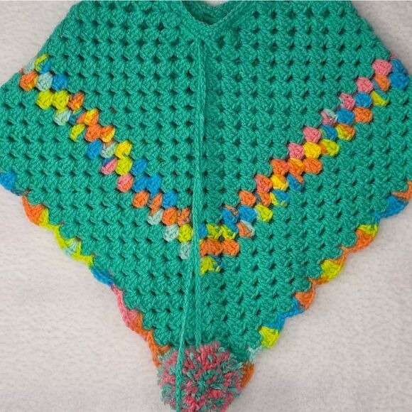 Poncho Handmade vibrant green crochet poncho adorned with pom-poms. - Picture 10 of 13